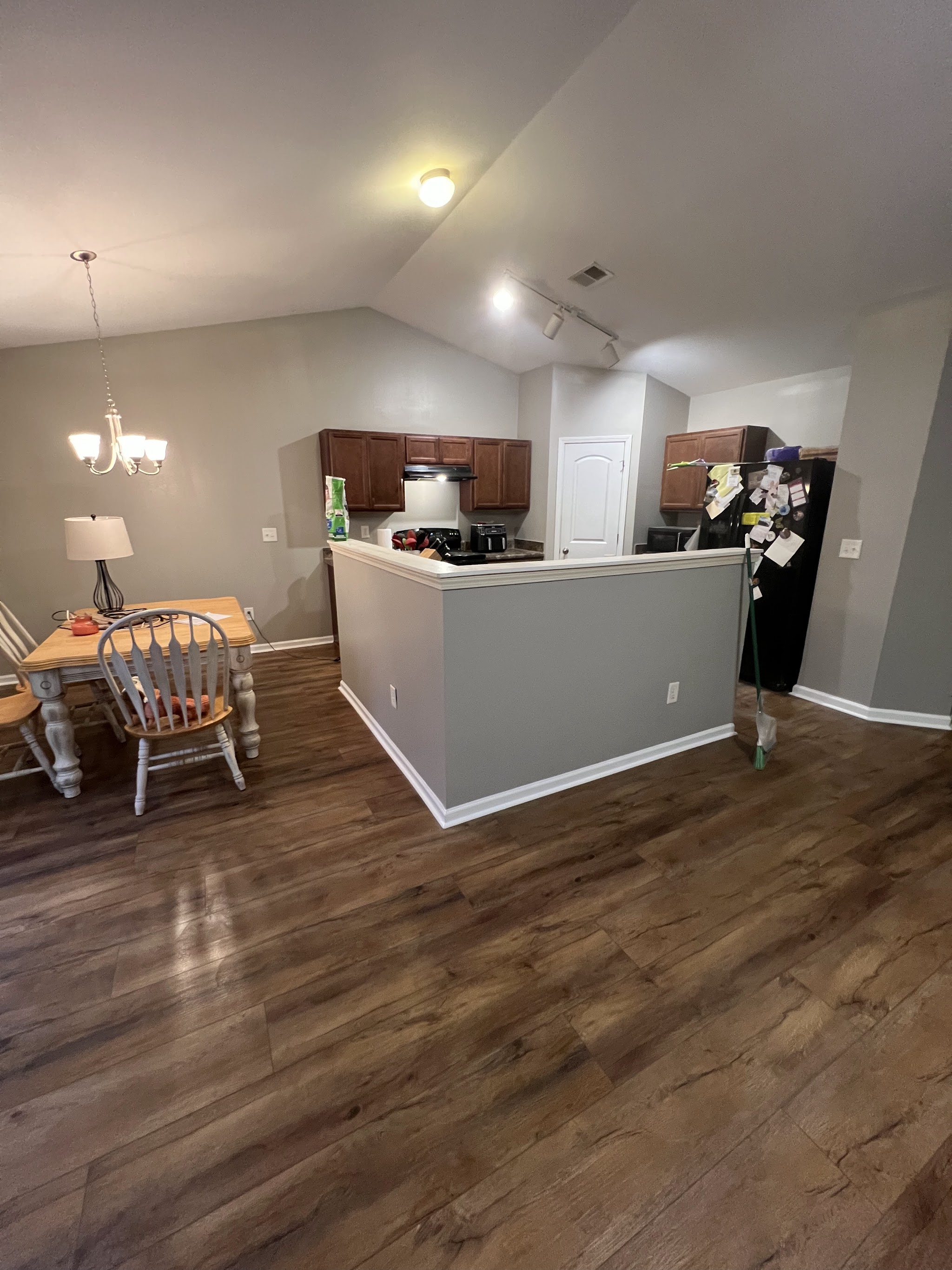 Open-plan kitchen and dining with new wood flooring
